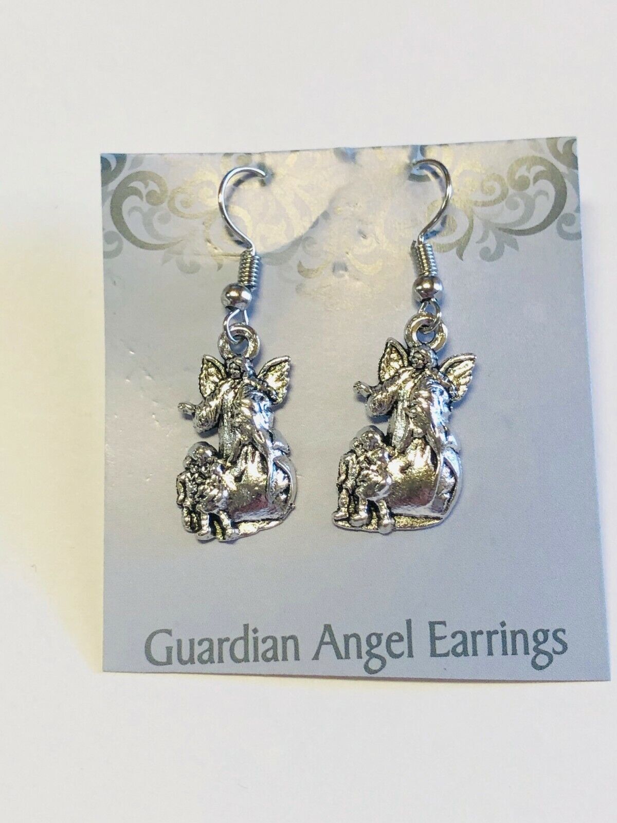 Guardian Angel Earrings, Silvertone, New - Bob and Penny Lord